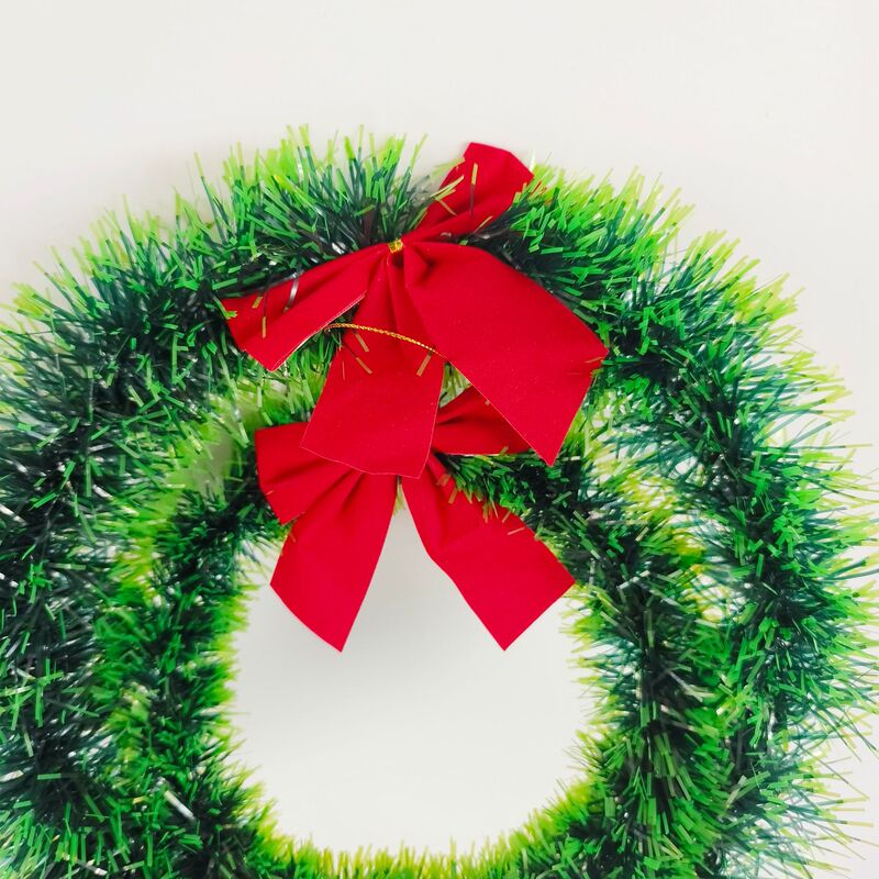 赤い蝶結びのクリスマスの花輪の輪の毛の条の色の条の装飾の花輪の緑の辺の白い辺の蝶結びの暗号化の花輪|undefined