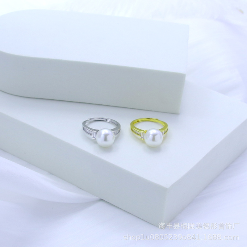 Rectangular small design ring with stone with zircon