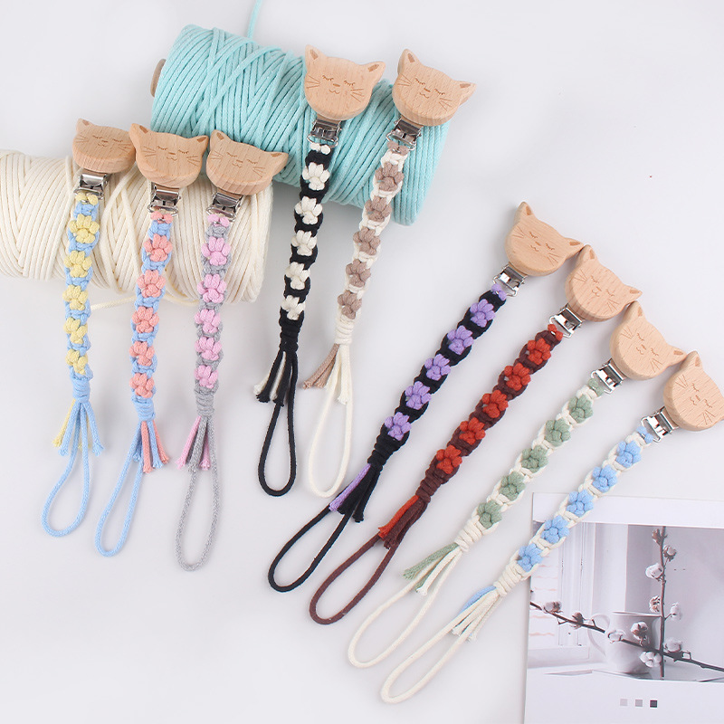 Nuevo clip de chupete de madera de haya de animal de dibujos animados creativo tejido a mano pata de perro textura chupete de algodón cadena anti-caída