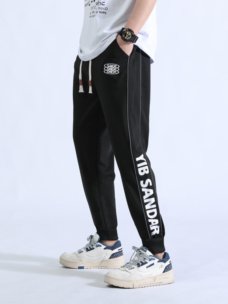 Pantalones deportivos para hombres primavera y otoño tendencia juvenil guapo ocio versátil cintura elástica transpirable pie pantalones largos