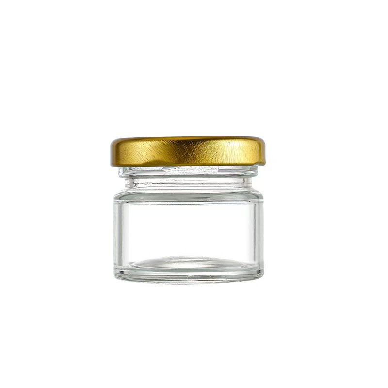 Inventario multi-especificaciones de latas de sellado transparentes de vidrio de seis bordes de miel botella de mermelada para probar mini pequeña botella de miel