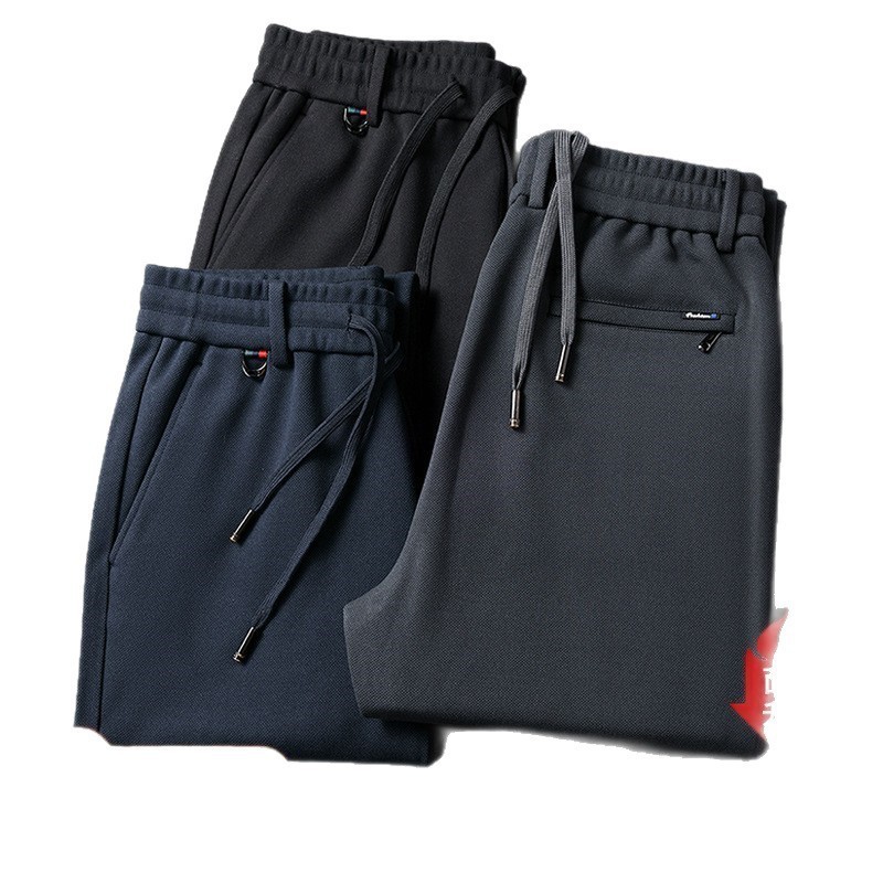 Otoño y invierno para hombres pantalones casuales elásticos sueltos rectos y pantalones gruesos de vello de cintura elástica pantalones de mediana edad y pantalones largos
