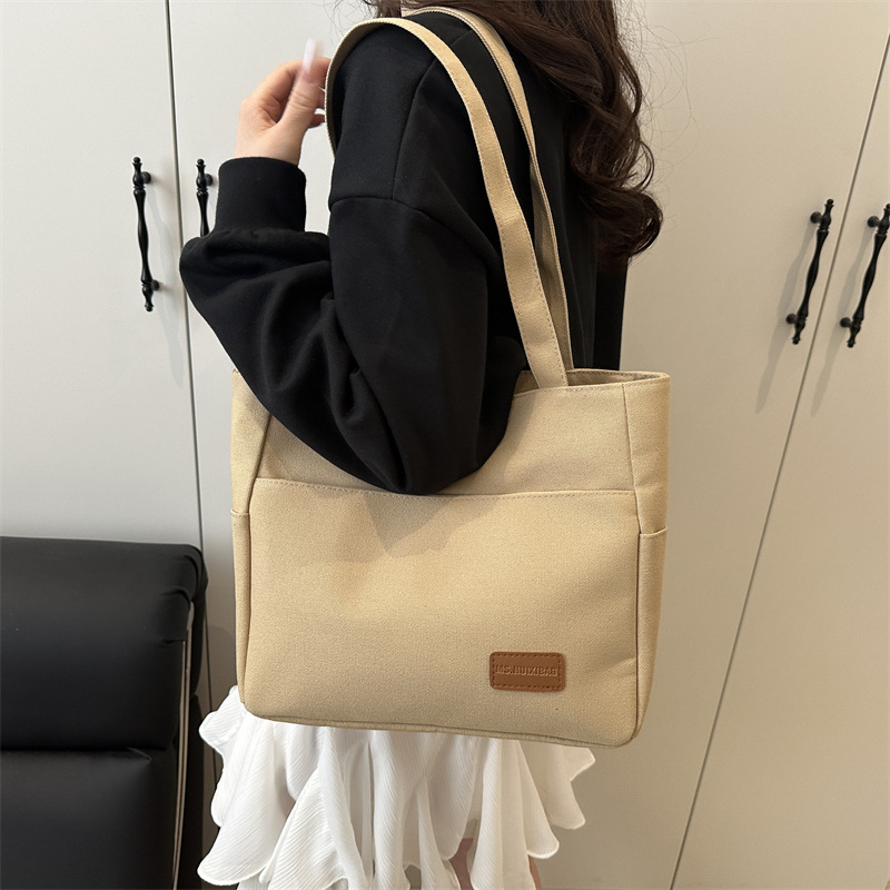 Bolsa de lona de alta capacidad para mujeres japonesas simple versátil bolso de hombro de viaje de estudiantes bolso especial