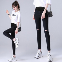 孕妇牛仔裤女九分春秋新款显瘦破洞小脚铅笔裤子