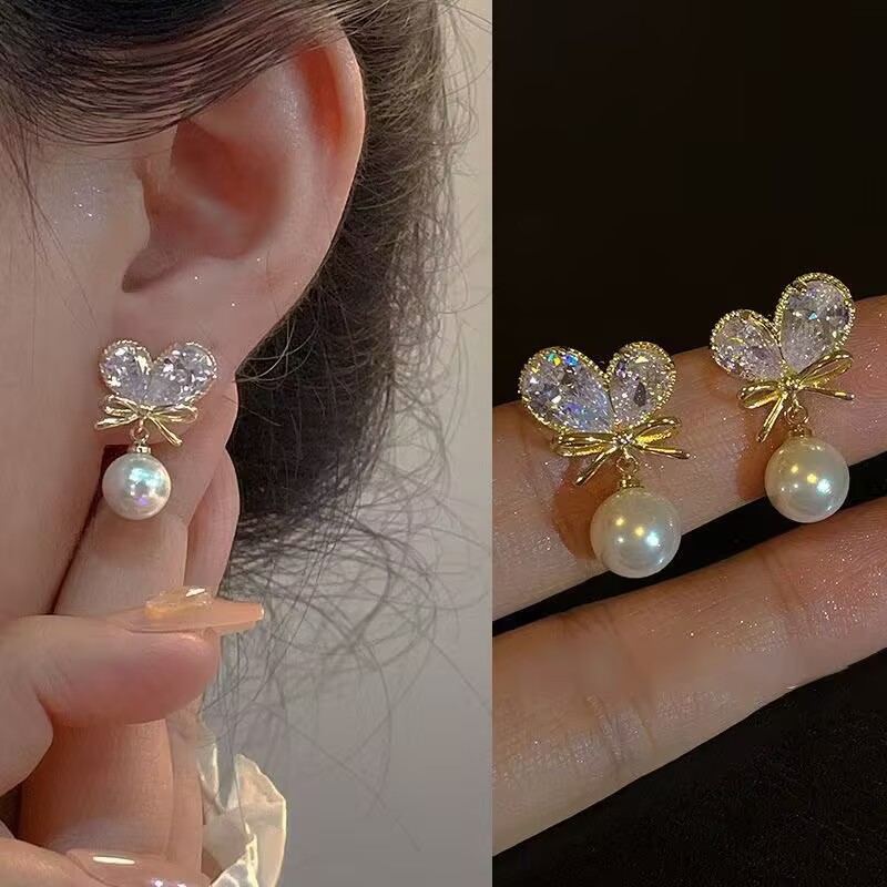 Cute universal elegant earrings with bow from pearl
