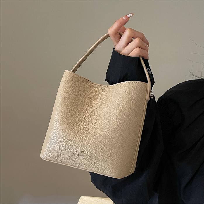 Bolsa de mano con estampado de litchi de alta calidad, dama, 2024 primavera y verano, nueva bolsa de hombro universal, diseño simple, bolsa de cubo