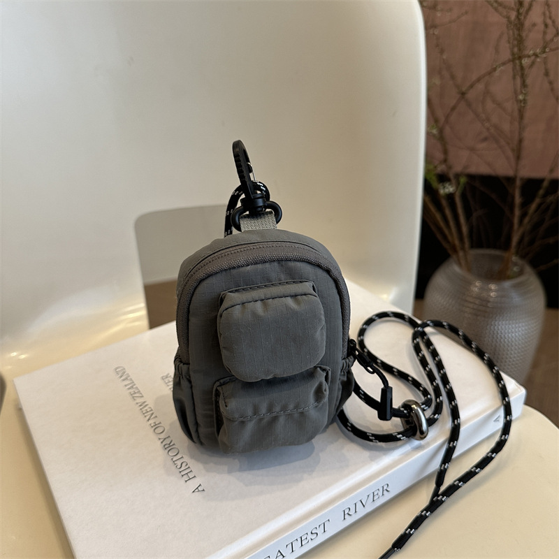 Mini colgante bolso de cambio 2025 nuevo cross-border nylon impermeable bolso de auriculares de bolsillo de hombro