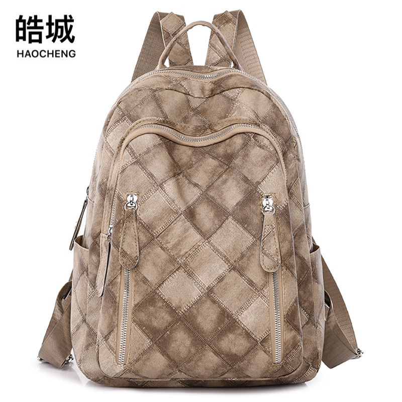 Spot al por mayor 2023 nueva mochila de cuero suave para mujer retro casual moda rombo urbano simple mochila marea