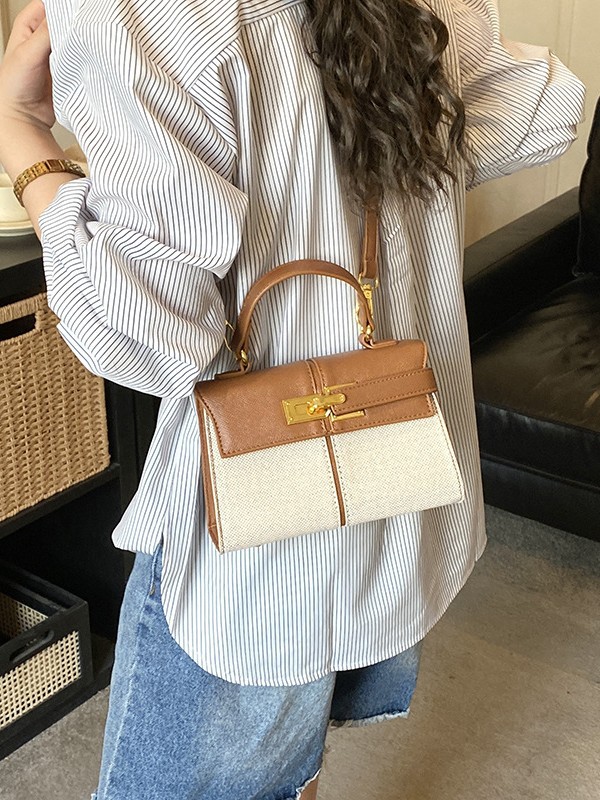 Lujo ligero color contrastante empalme bolso de mano pequeño para mujeres 2026 ventas calientes nueva moda versátil alta sensación mochila