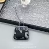 Чёрный (коровий принт, серебристая цепочка)