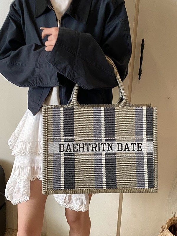 Trend Cross-border del sudeste asiático bolso portátil Tote femenino 2025 nuevo bolso de hombro casual a rayas de tela