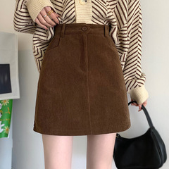 秋冬のカレー色の半身のスカートの女性のコーデュロイのスカート