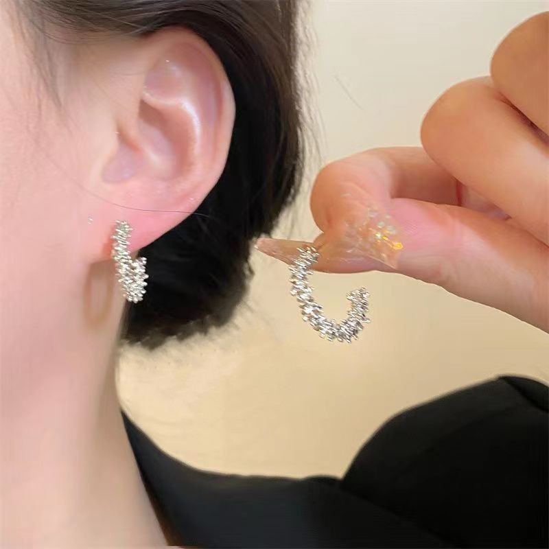 Broken silver caterpillar earrings