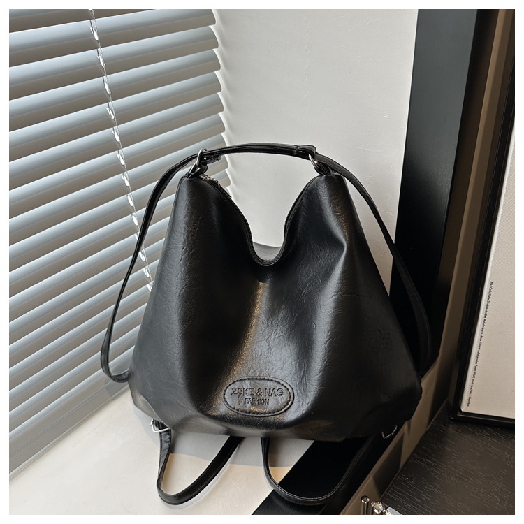 The 2024 new pleated tote bag is a large-capacity casual and fashionable backpack for women, featuring multi-functional texture and a single-shoulder crossbody bag undefined