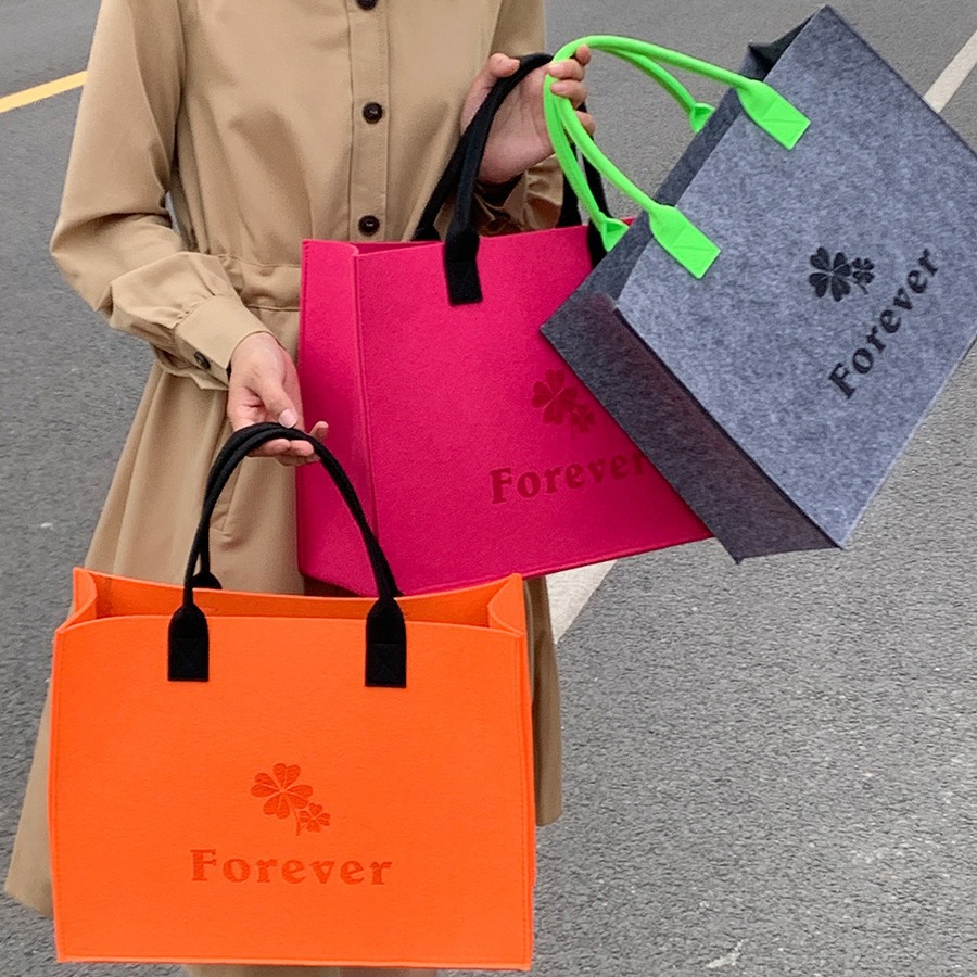 包邮新款拼色毛毡包印刷公司广告logo手提袋儿童礼品包装袋时尚