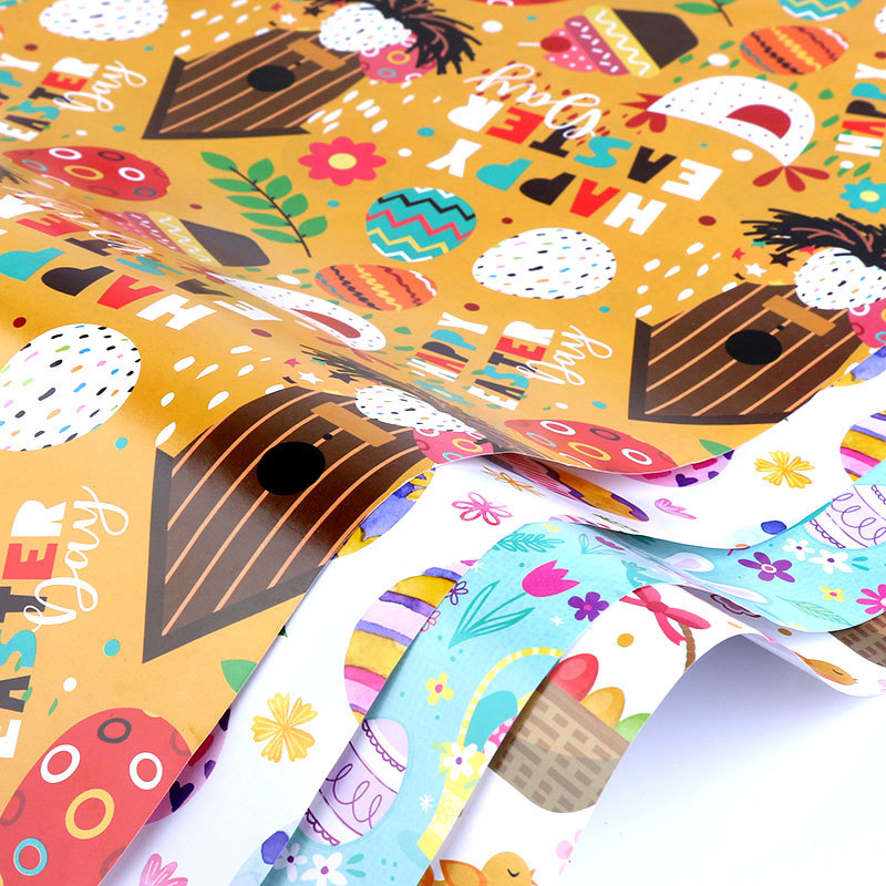Papel de regalo de Pascua con diseño de conejo de dibujos animados para envoltura de regalos de productos nuevos transfronterizos de Amazon, fabricante mayorista de embalaje de regalos para bricolaje.
