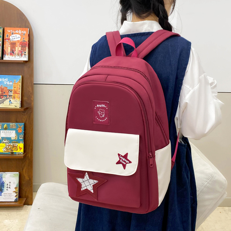 Mochila de estudiante de secundaria para mujer 2025 nuevo estilo ins versión coreana de alta apariencia y gran capacidad para estudiantes de secundaria estilo universitario mochila