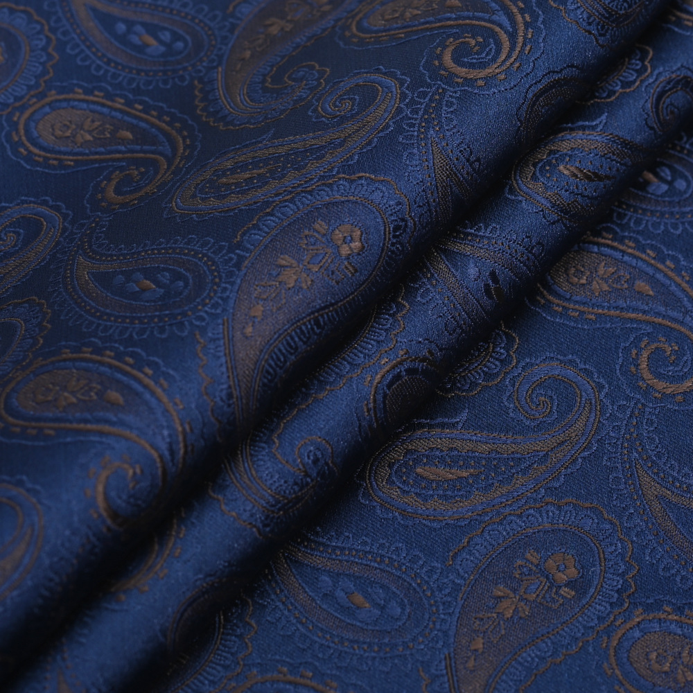 厂家供应新款藏青色涤丝提花色织面料佩期利腰果花领带面料