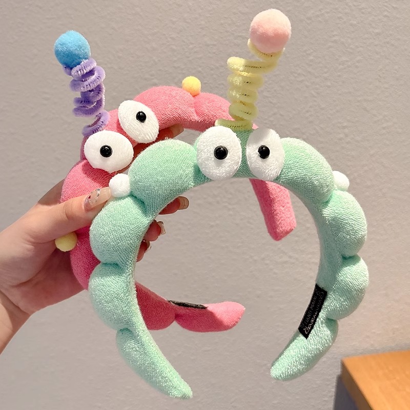 Hermosos ojos grandes torsión varilla esponja banda de cabello para mujeres creativa extraña banda de cabello antideslizante tocado de lavado de cara broca de cabello