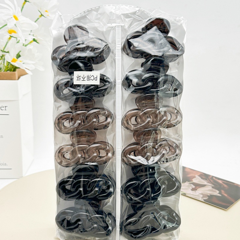 Pinza para el cabello de material PC irrompible color té con leche, pinza grande transparente color café para la parte posterior de la cabeza, accesorio para el cabello de supermercado a dos yuanes.