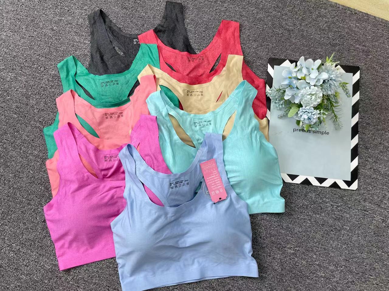 Nueva ropa interior deportiva de color sólido de las mujeres pequeño pecho push up pecho grande pequeño sujetador inalámbrico adhesivo sin costuras Sujetador deportivo