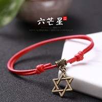 Pulsera tejida a mano – motivos trébole/póker, estilo unisex vintage