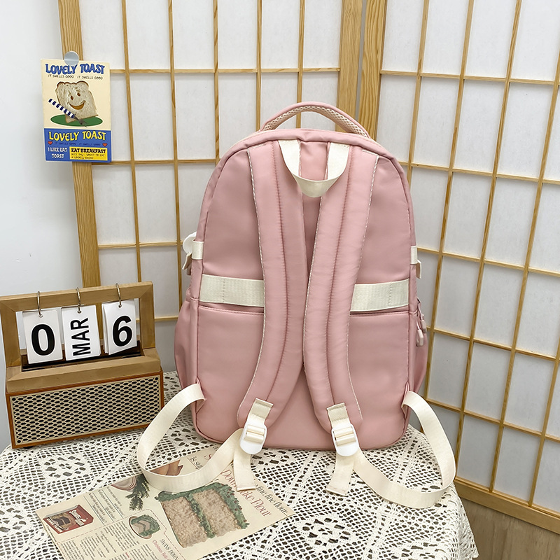 Mochila escolar 2024 mochila de estilo nuevo todo fósforo ocio para estudiantes de secundaria y preparatoria Mochila de viaje de color de contraste simple y de gran capacidad