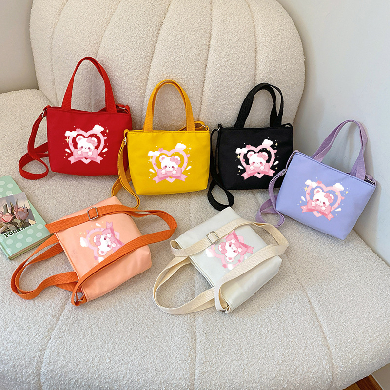 Cartoon bear, bolsas de hombro para niños y niñas, impresión de aire extranjero, bolsas de mano para bebés dulces, bolsas para niños 2025 nuevas bolsas para niños