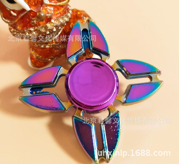 B Dedos de araña de colores, peonza, yema del dedo de metal de tres hojas, peonza de dos hojas, productos pequeños, suministro al por mayor