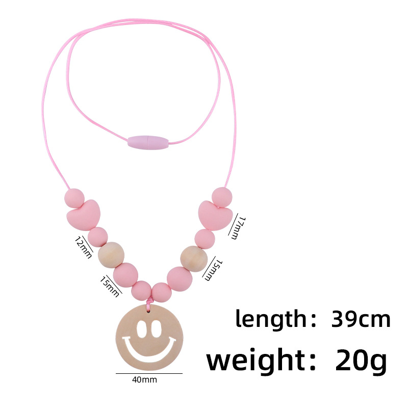 Nuevo bebé suministros smiley cara mordedor collar bebé cuentas de silicona mordida molar masticable colgante collar