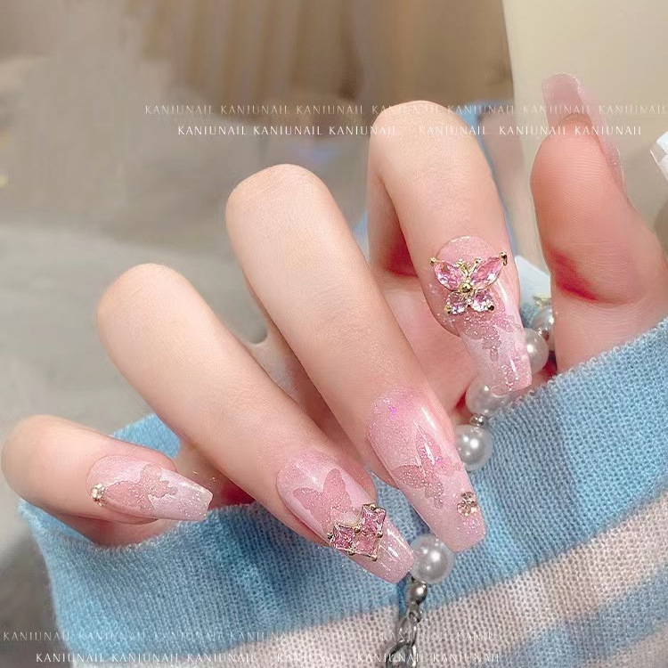 Lujo ligero súper centelleante mariposa de circón joyería de uñas metal súper hada pequeña mariposa manual uñas accesorios al por mayor