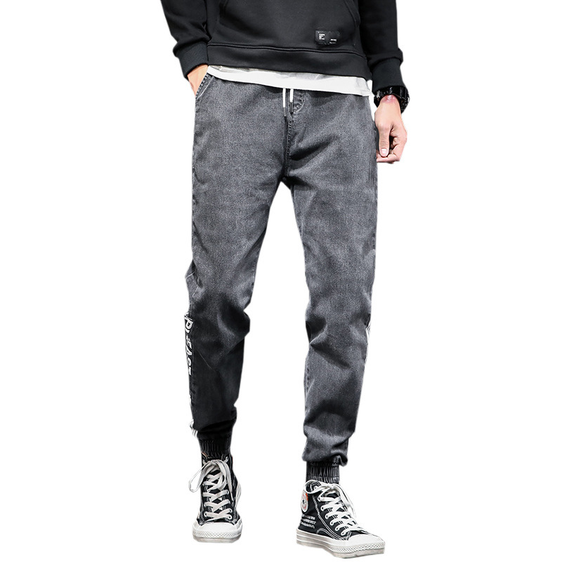 Jeans casuales de cintura elástica sueltos para hombres primavera de moda coreana para hombres, nueve puntos.