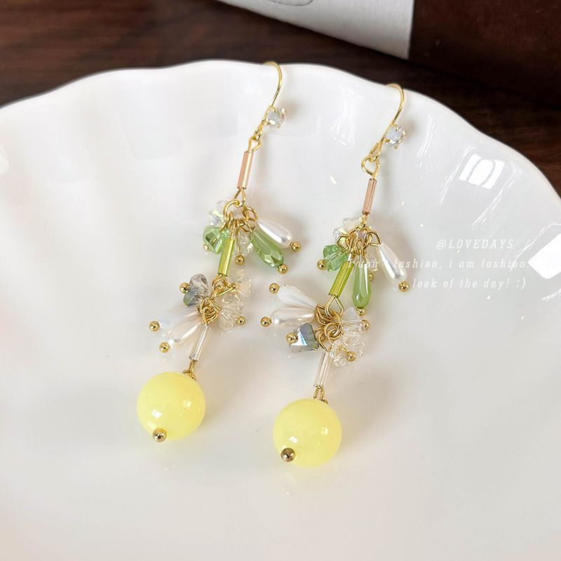 Green small beaded bracelet with tassels