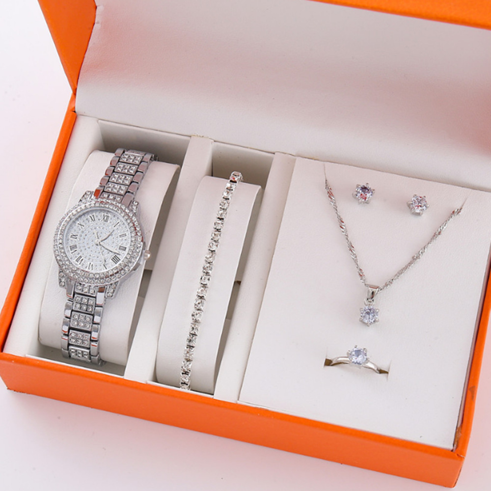 Nuevo producto para mujer 5pcs/set moda de nicho todo fósforo falso traje de reloj de cuarzo con cinturón de acero de tres ojos