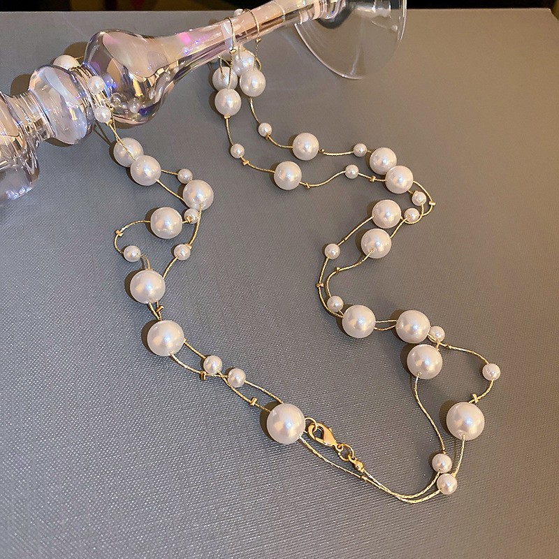 Collar con cuentas de perlas de gota de agua con diamantes transfronterizos otoño e invierno cadena de suéter de lujo ligero francés moda todo fósforo joyería de alta gama