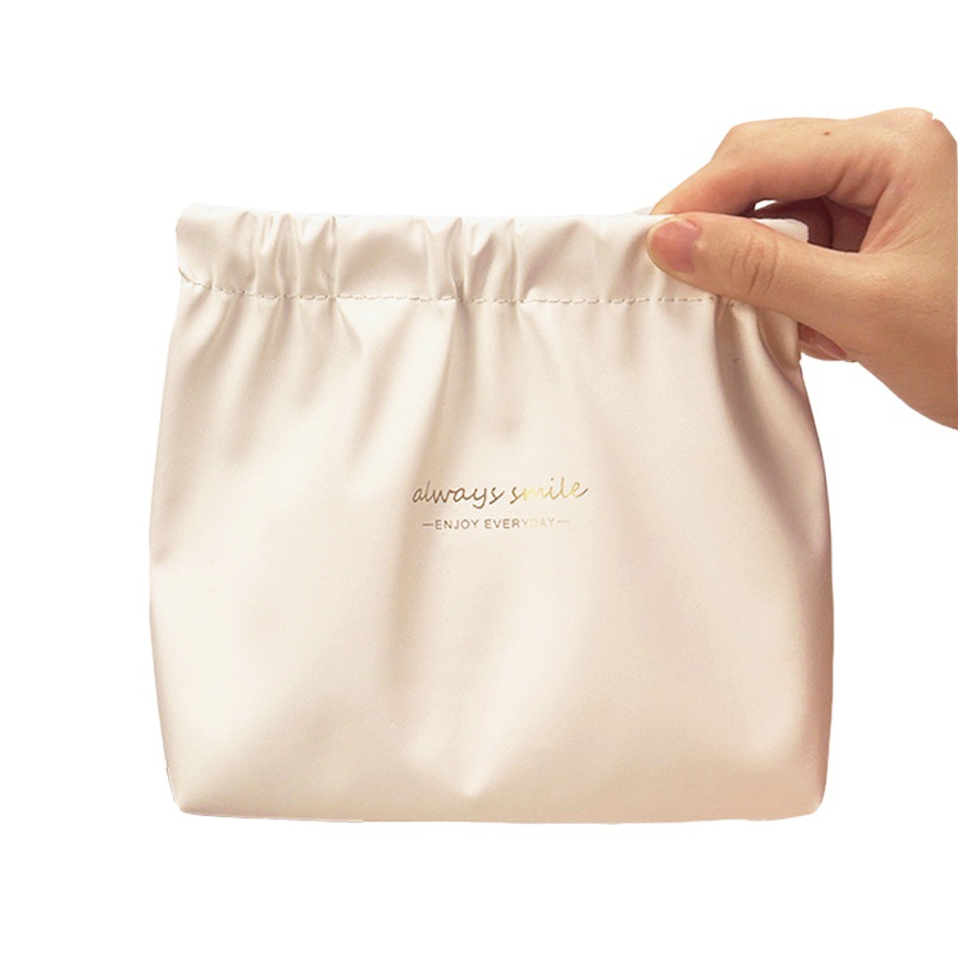 Nuevo impermeable pu bolsa de cosméticos lápiz labial de las mujeres sanitaria servilleta metralla bolsa de almacenamiento portátil cable de datos auriculares bolsa de almacenamiento