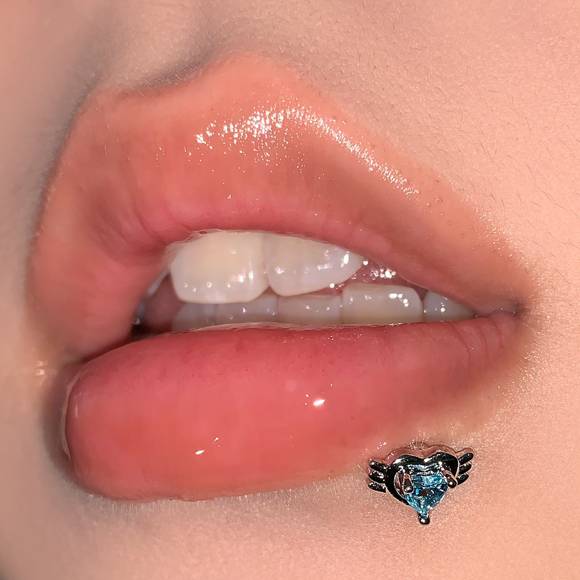 Silver pointed spike labret stud material detail