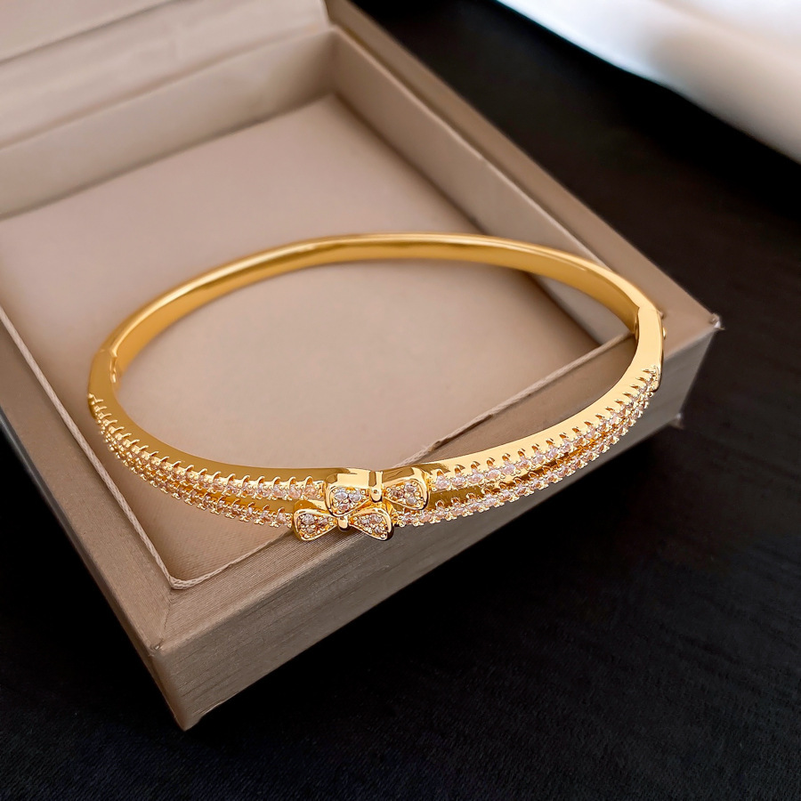 Pulsera 42 - doble capa de lazo de zircon (chapada en oro real)