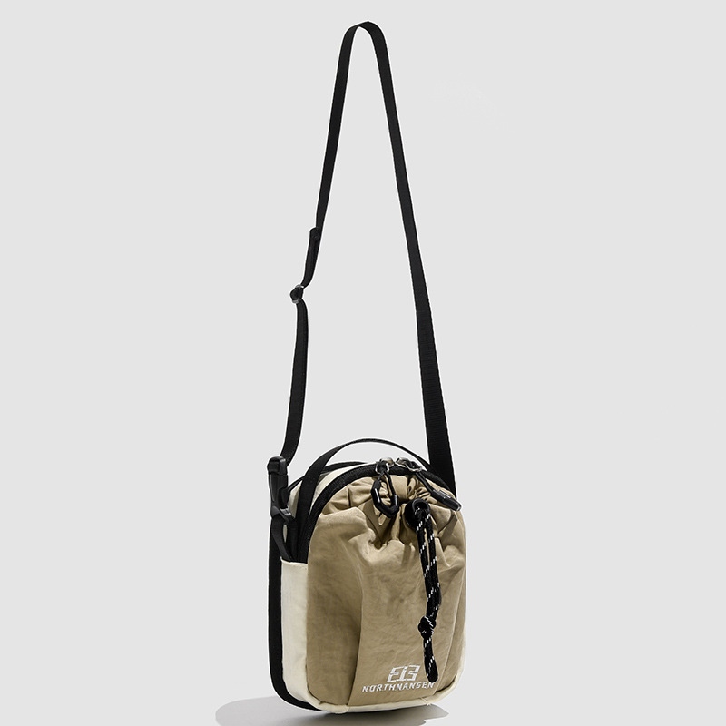 Primavera y verano de 2025 nuevo estilo de alta moda versátil para hombres y mujeres bolsos casuales para teléfonos móviles de cuerda de tirado bolso de hombro