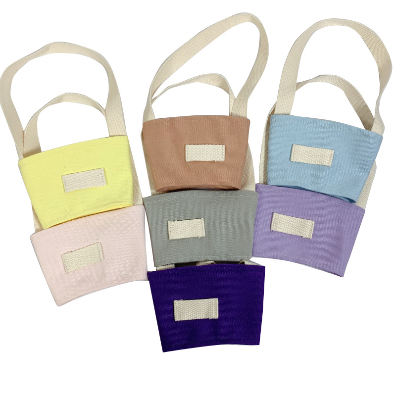 Fábrica al por mayor color sólido leche taza de té cubierta lona embalaje bebidas portátil bolso café taza mano