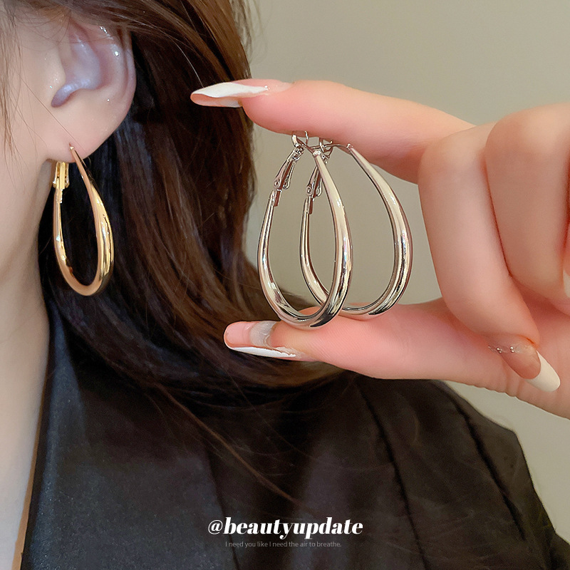 Aguja de plata anillo de forma ovalada simple anillo de oreja mujer minimalista estilo frío pendiente exagerada moda alta sentido al por mayor