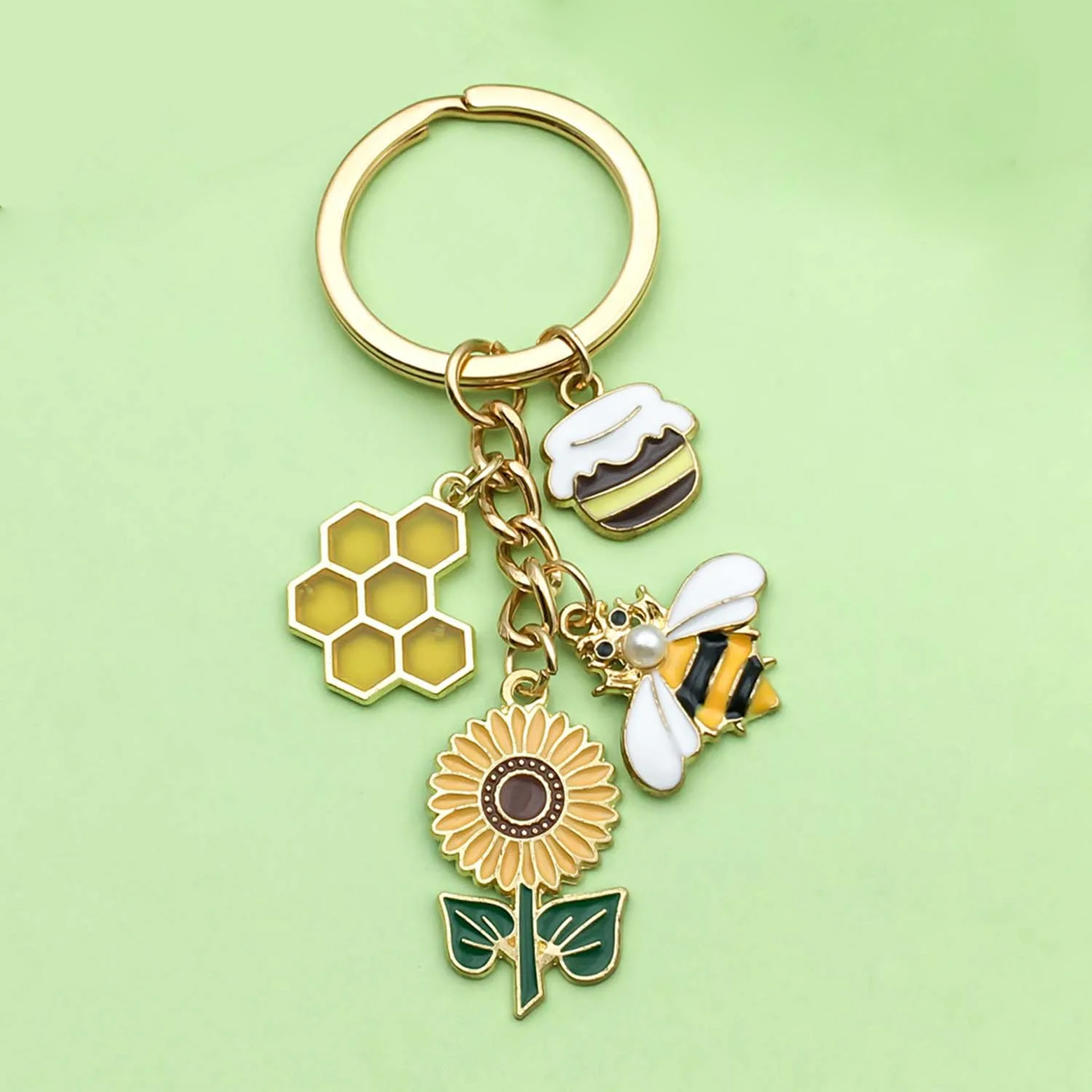 Ventas transfronterizas personales colgantes perlas abejas colgantes girasoles joyas de Navidad ardilla llaveros