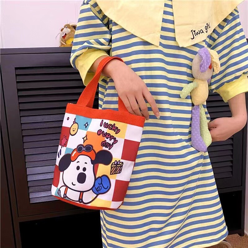 かわいい落書きバケツバッグinsプリント円筒バッグキャンバス弁当袋韓風少女は弁当箱を持っています。|undefined