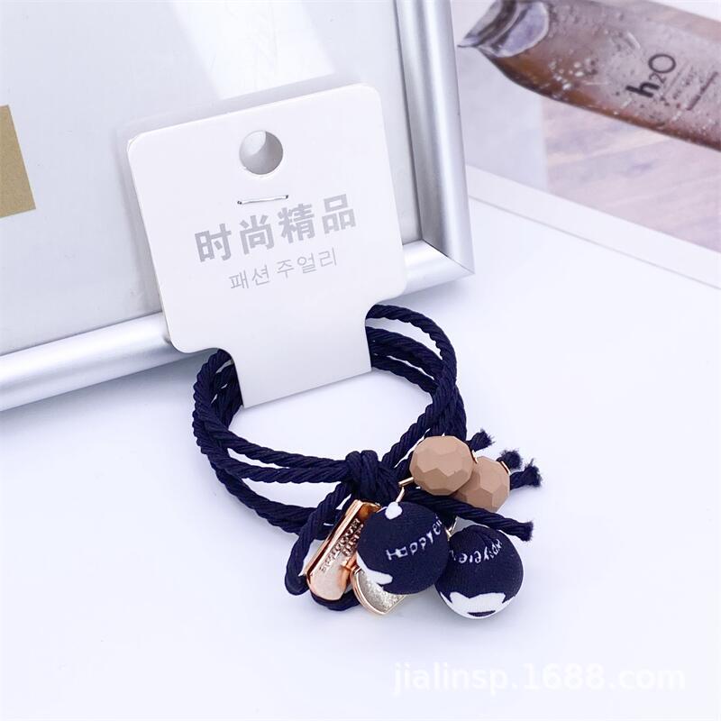 Otoño e invierno té de leche color paño bola cuerda del pelo 2 tarjetas leopardo cabeza cuerda simple hilo colgando bola banda de goma 2 yuanes tienda de suministro