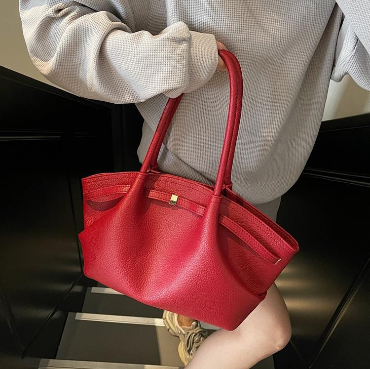 Nicho de diseño de bolsas de cubo de mano para mujeres 2025 nuevo estilo de moda de hombro bolsas de viaje de estilo retro bolsas de brazo