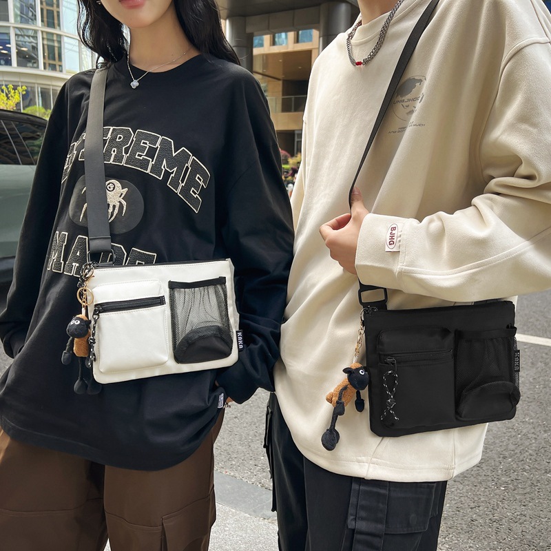 Bolso de hombro transfronterizo de gran capacidad, bolso de correo universal, bolso coreano, bolso de estilo casual, bolso de mano para hombres y mujeres.