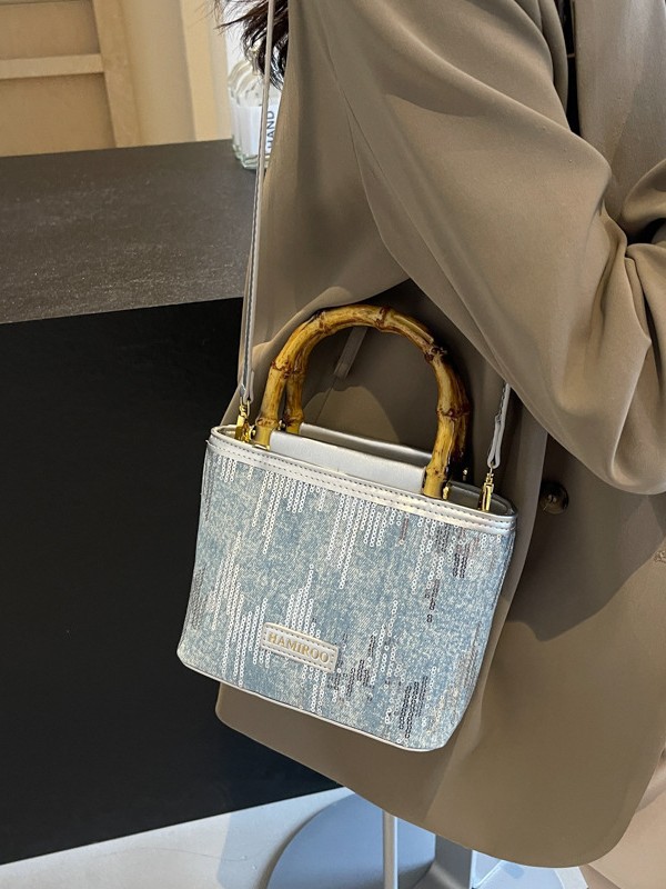 Bolso de mano de bambú para mujeres 2025 nuevo verano bolso de balde de vaquín coreano bolso de hombro mochila de moda
