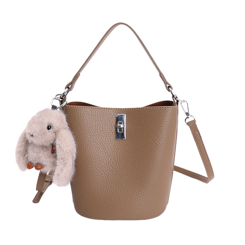 Bolso de nicho coreano portátil cubo de agua bolso para niños ventas calientes nueva textura de alta calidad lujoso ligero ocio versátil bolso de mochila