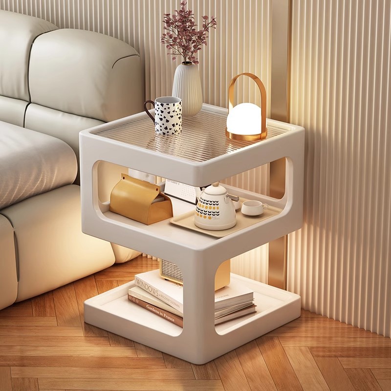 Sofá de lado unos pocos modernos y simples sala de estar casera pequeña mesa de té creativa cama de aire crema estante de cabecera