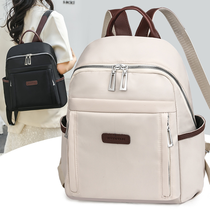 Venta al por mayor transfronteriza 2024 invierno nuevo estilo casual damas mochila de nailon simple y versátil mochila de viaje ligera marea